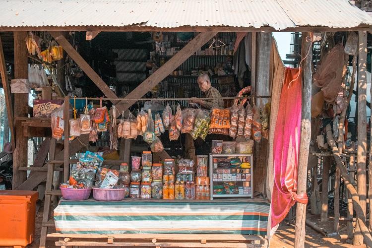Kampong Phluk floating village man in a local shop